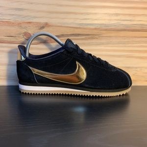 nike black & gold cortez suede trainers